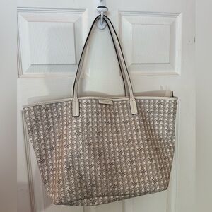 Tory Burch Ever-Ready Zip Tote in a cream and black monogram basketweave pattern